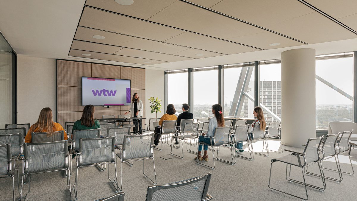 large-conference-room-with-person-presenting-at-wtw-paris-office