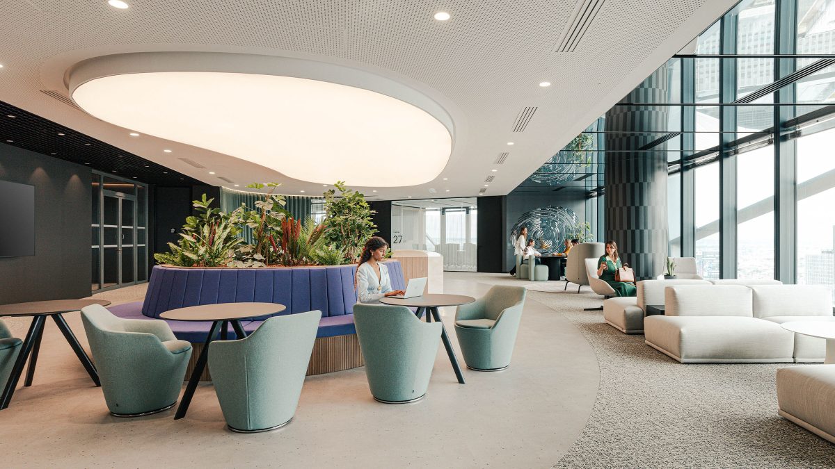 arrival-area-with-multiple-lounge-settings-at-wtw-paris-office