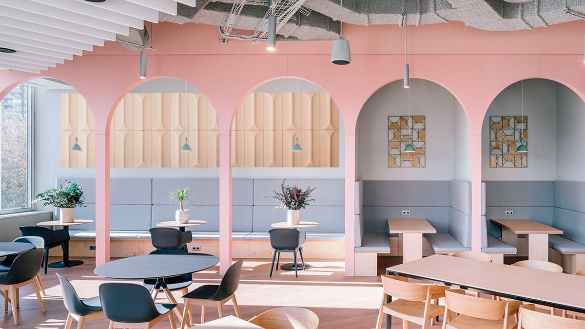 a-view-of-a-cafe-seating-area-with-a-soft-pastel-interior