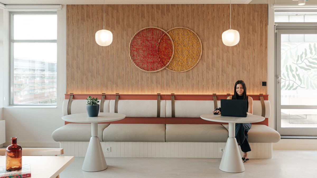 person-working-underneath-woven-mastercard-logo-installation