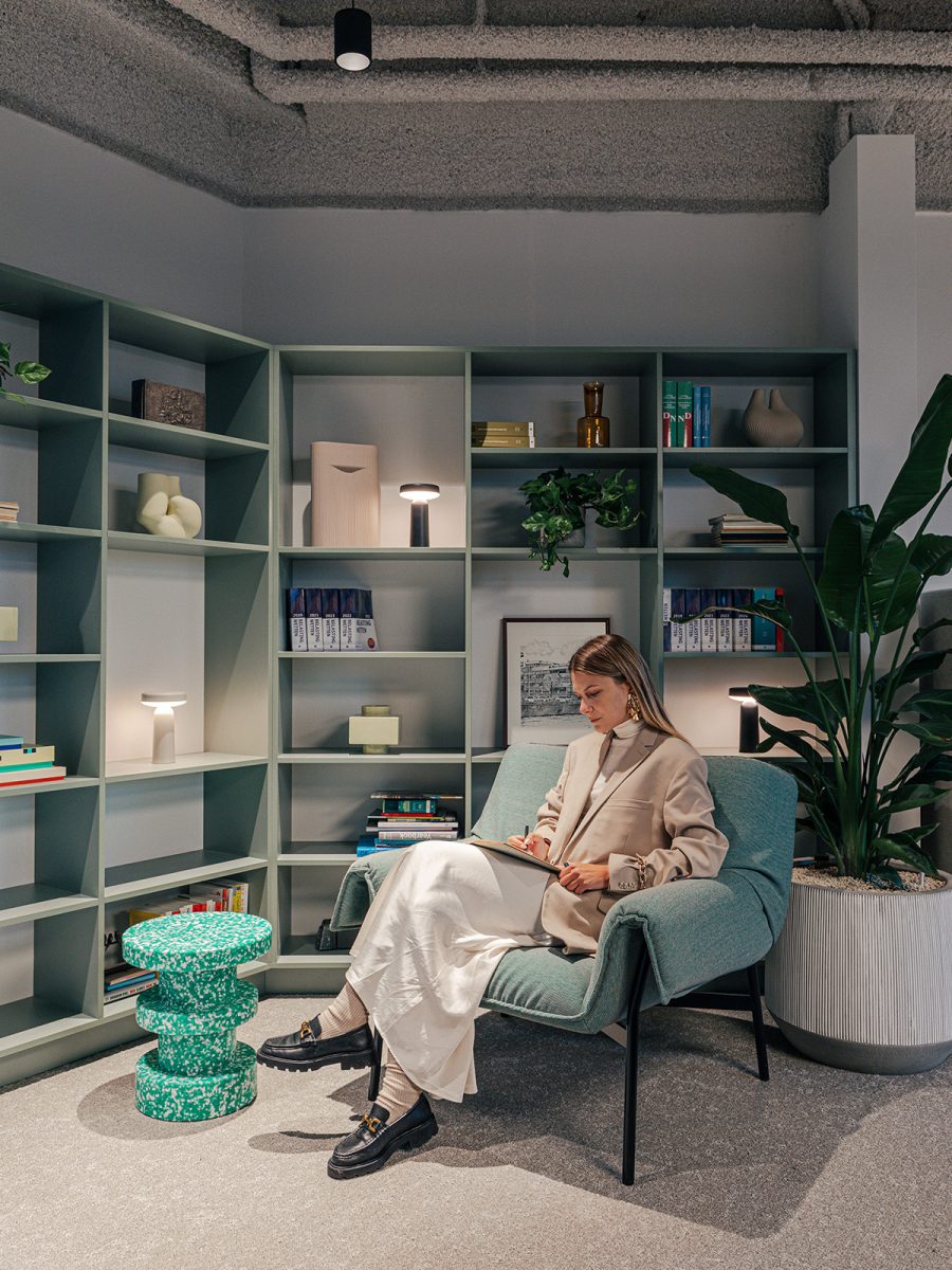 person-reading-in-library-space-at-ey-groningen-office